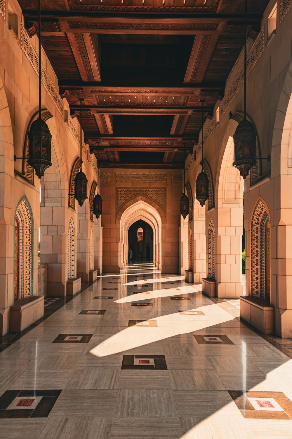 Sunlit arched walkway inside a mosque